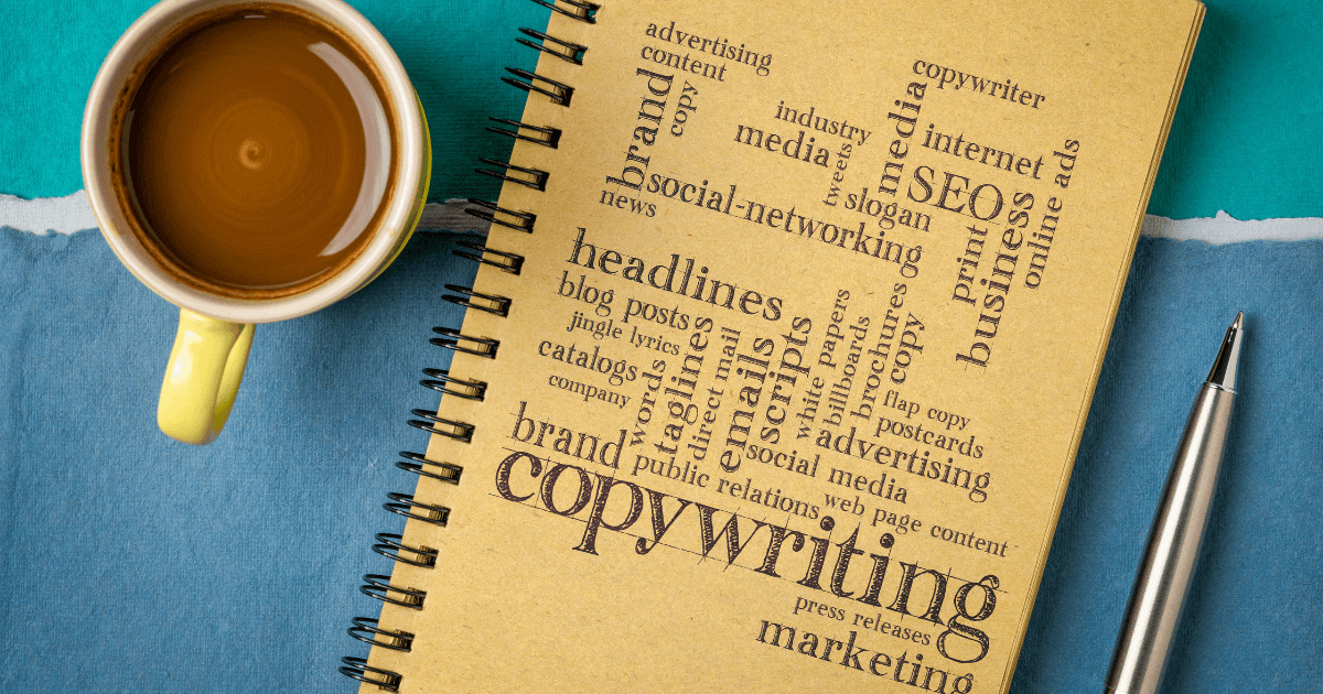 A picture of a notebook with "copywriting" on the front and a cup of coffee